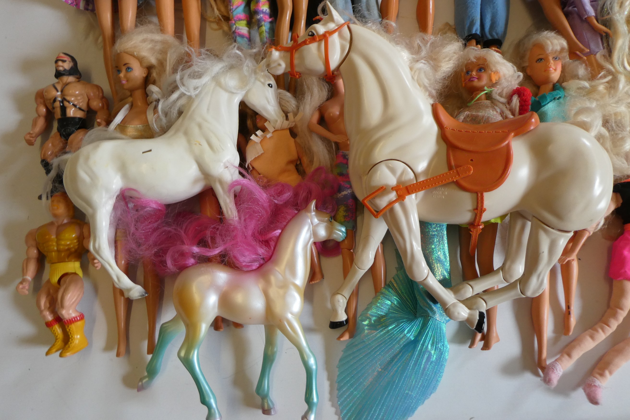 Six Barbie dolls with two Ken dolls, two sisters, nine other dolls, three unassociated horses and Image