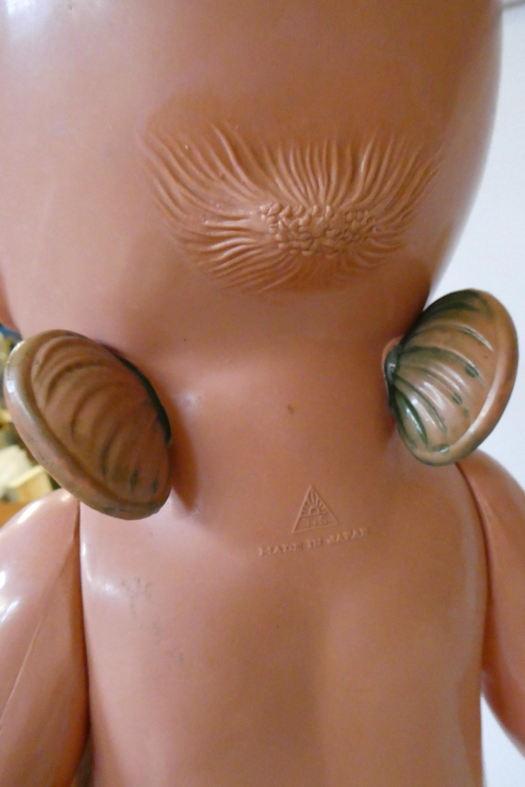 Three large Kewpie type dolls, one 26" celluloid doll, a 17 1/2" composition girl and a 13 1/2" Image