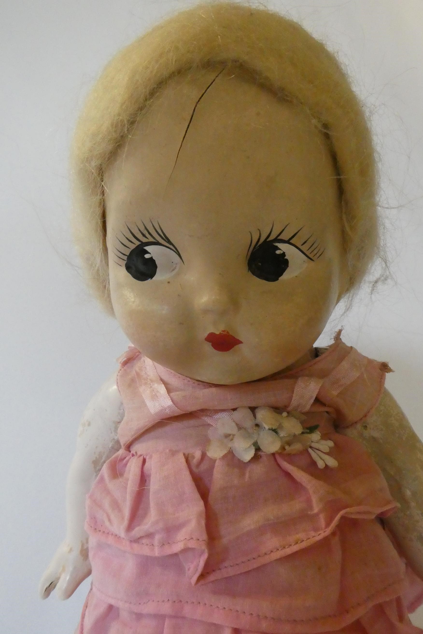 Three large Kewpie type dolls, one 26" celluloid doll, a 17 1/2" composition girl and a 13 1/2" Image