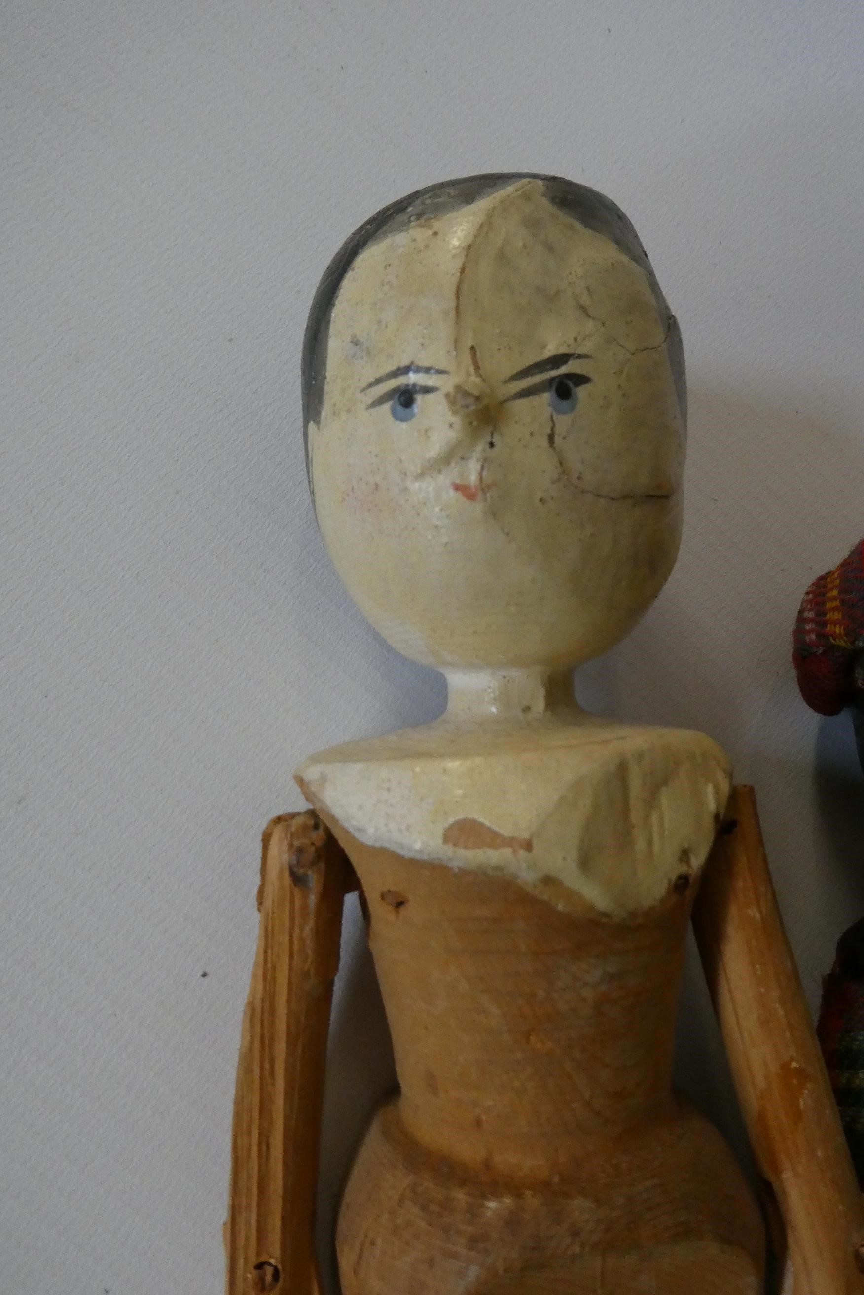 Five wooden peg dolls, comprising one 11 3/4" Victorian example, a 10" Scottish doll with metal Image