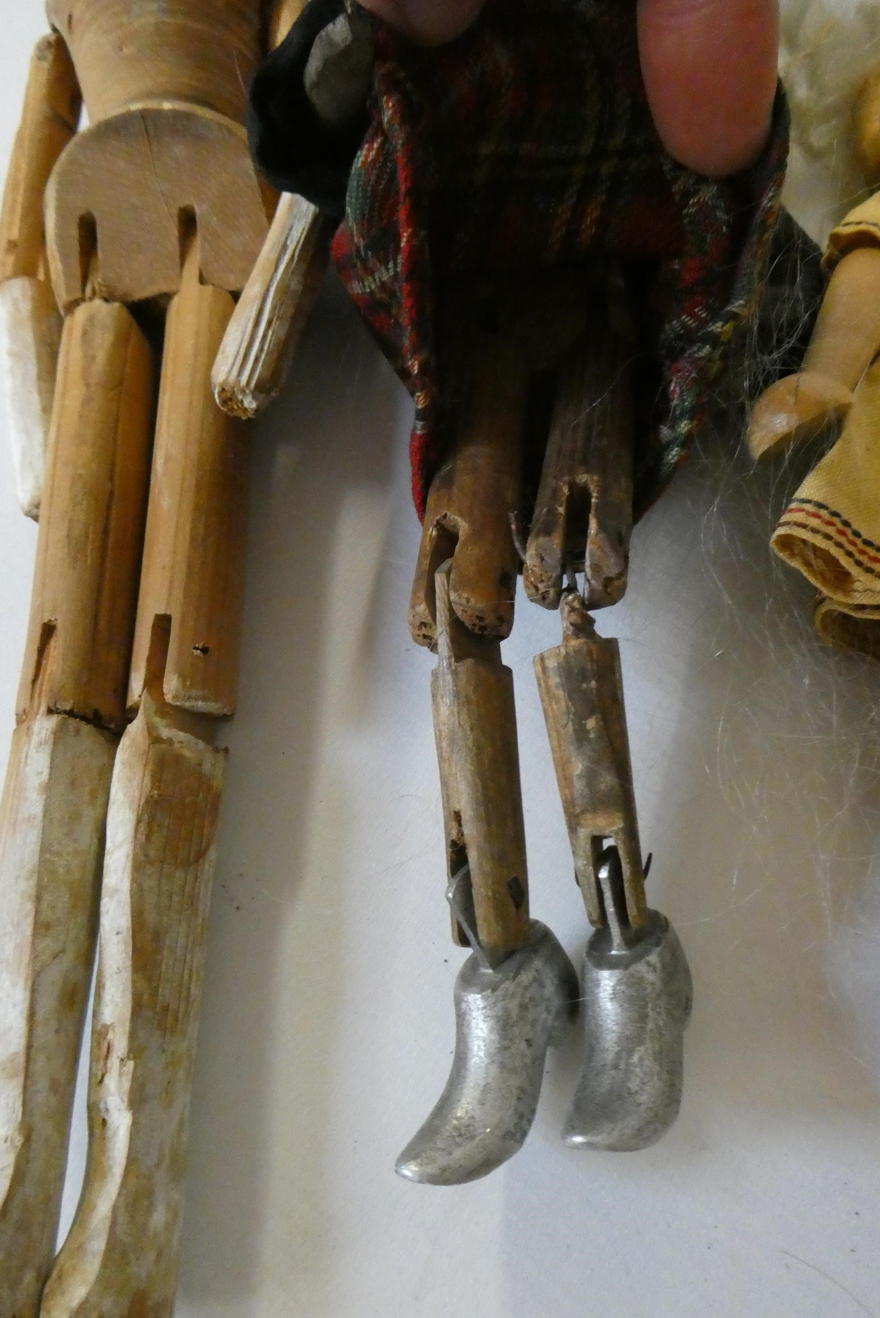 Five wooden peg dolls, comprising one 11 3/4" Victorian example, a 10" Scottish doll with metal Image