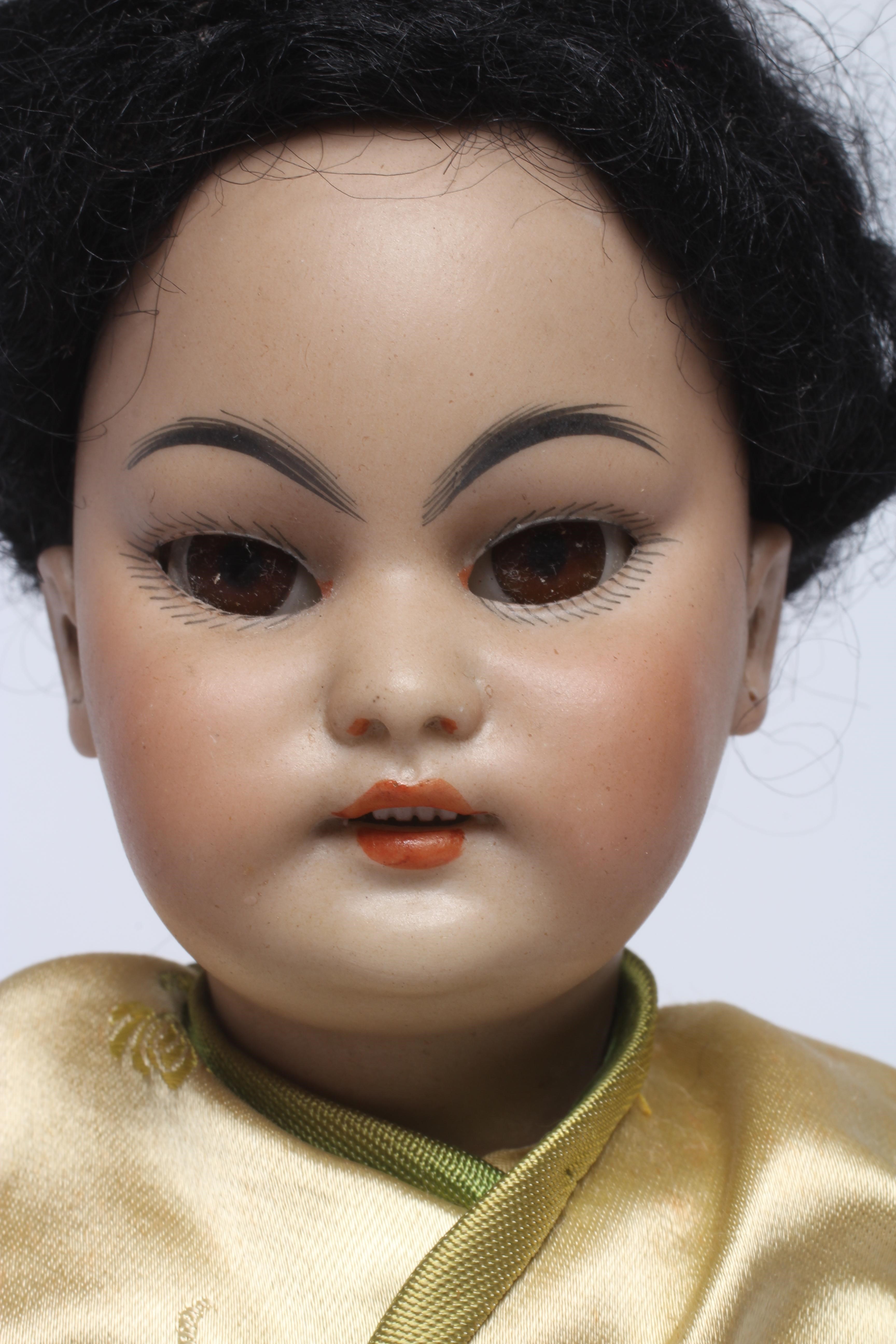 A Simon & Halbig bisque socket head Asian girl doll Image