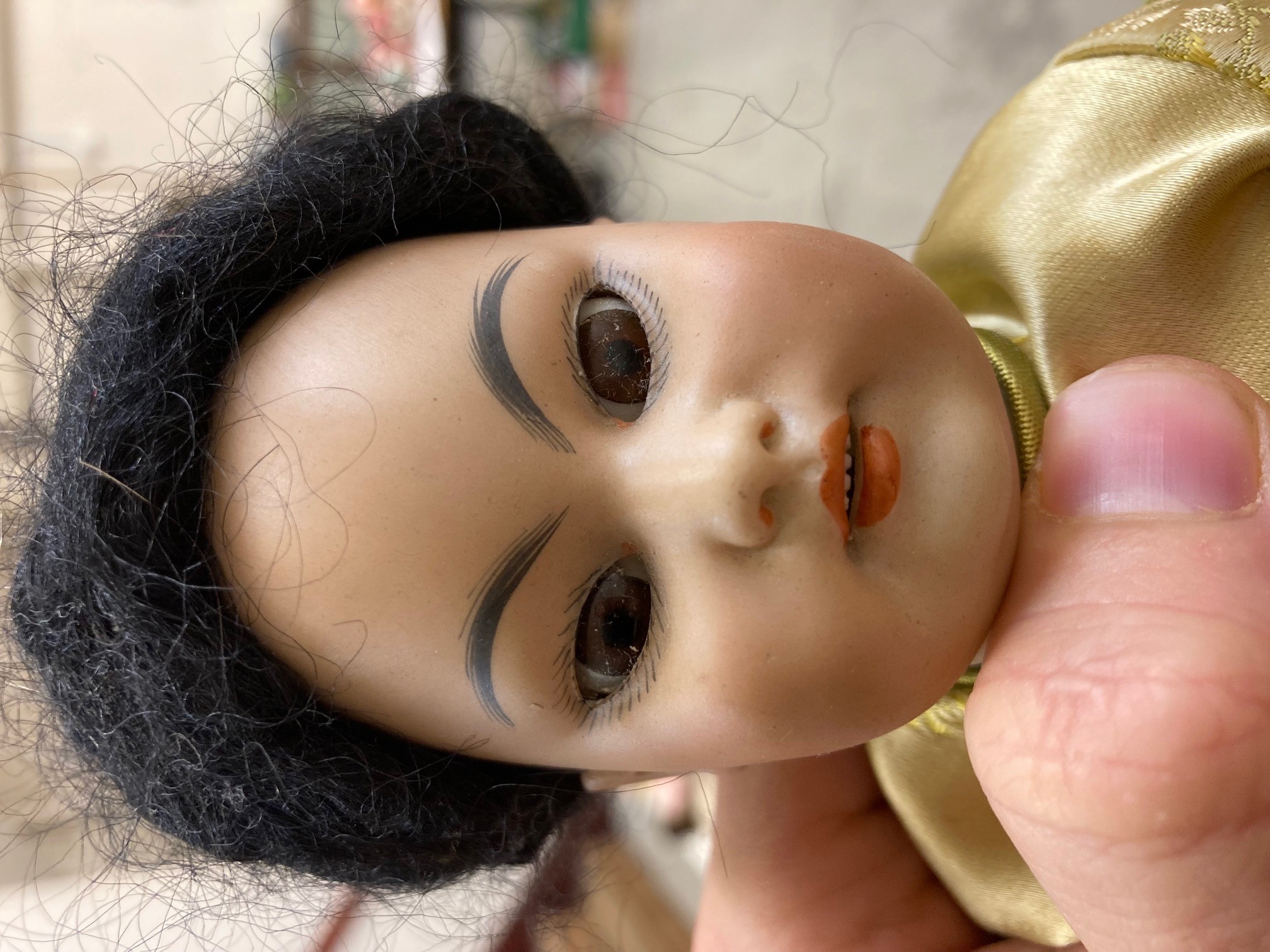A Simon & Halbig bisque socket head Asian girl doll Image