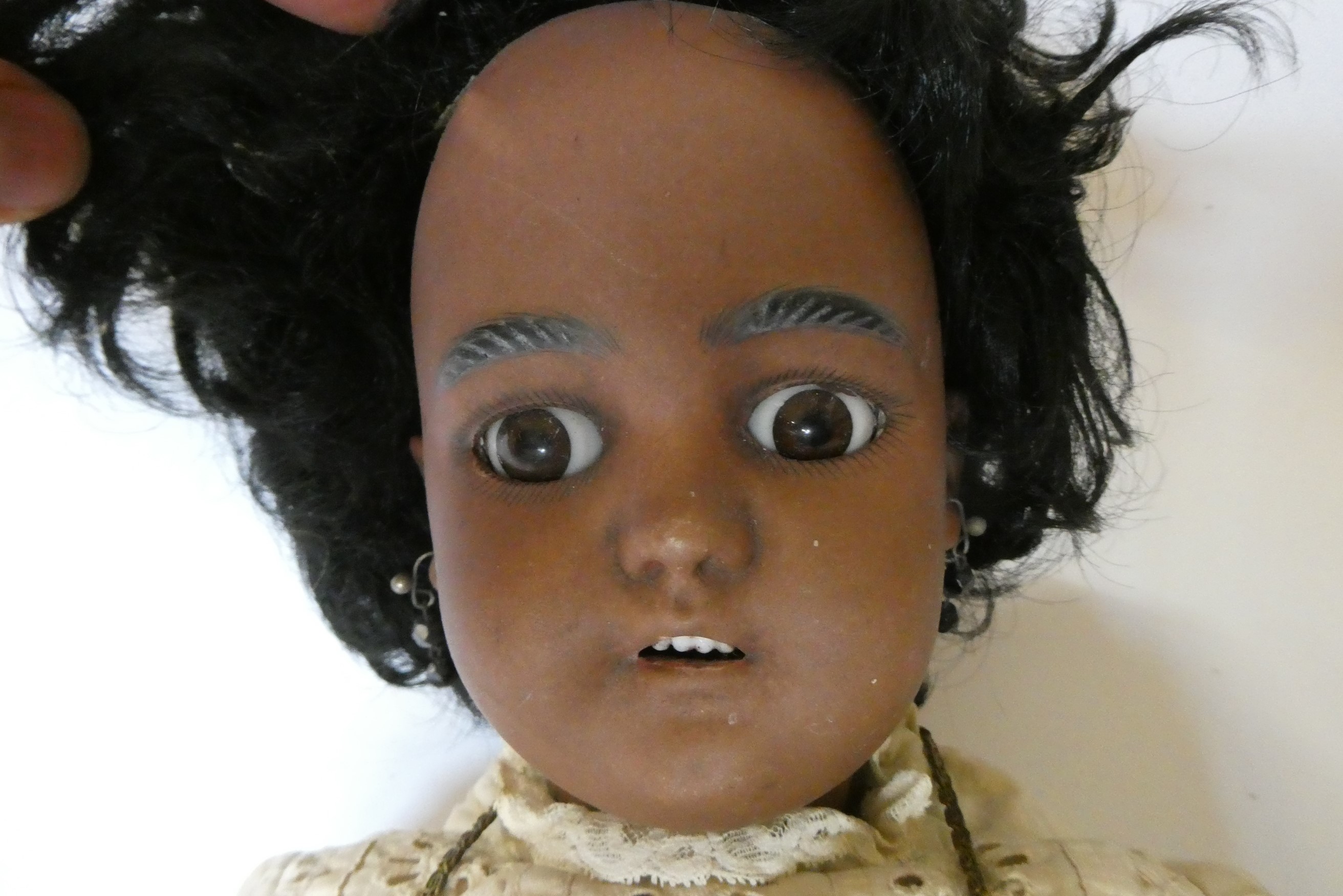 A Simon & Halbig bisque socket head girl doll Image