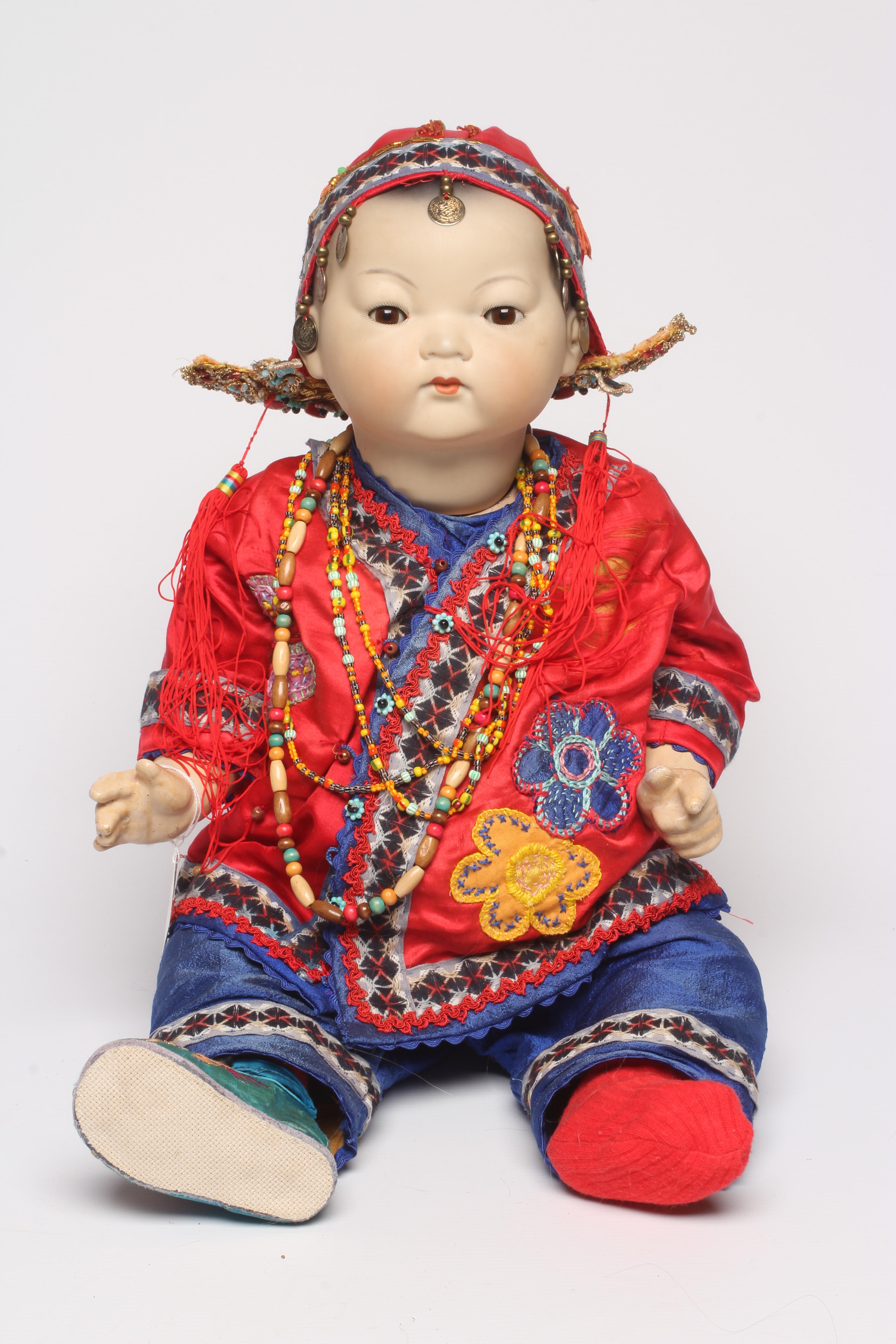 An Armand Marseille bisque socket head Asian doll Image