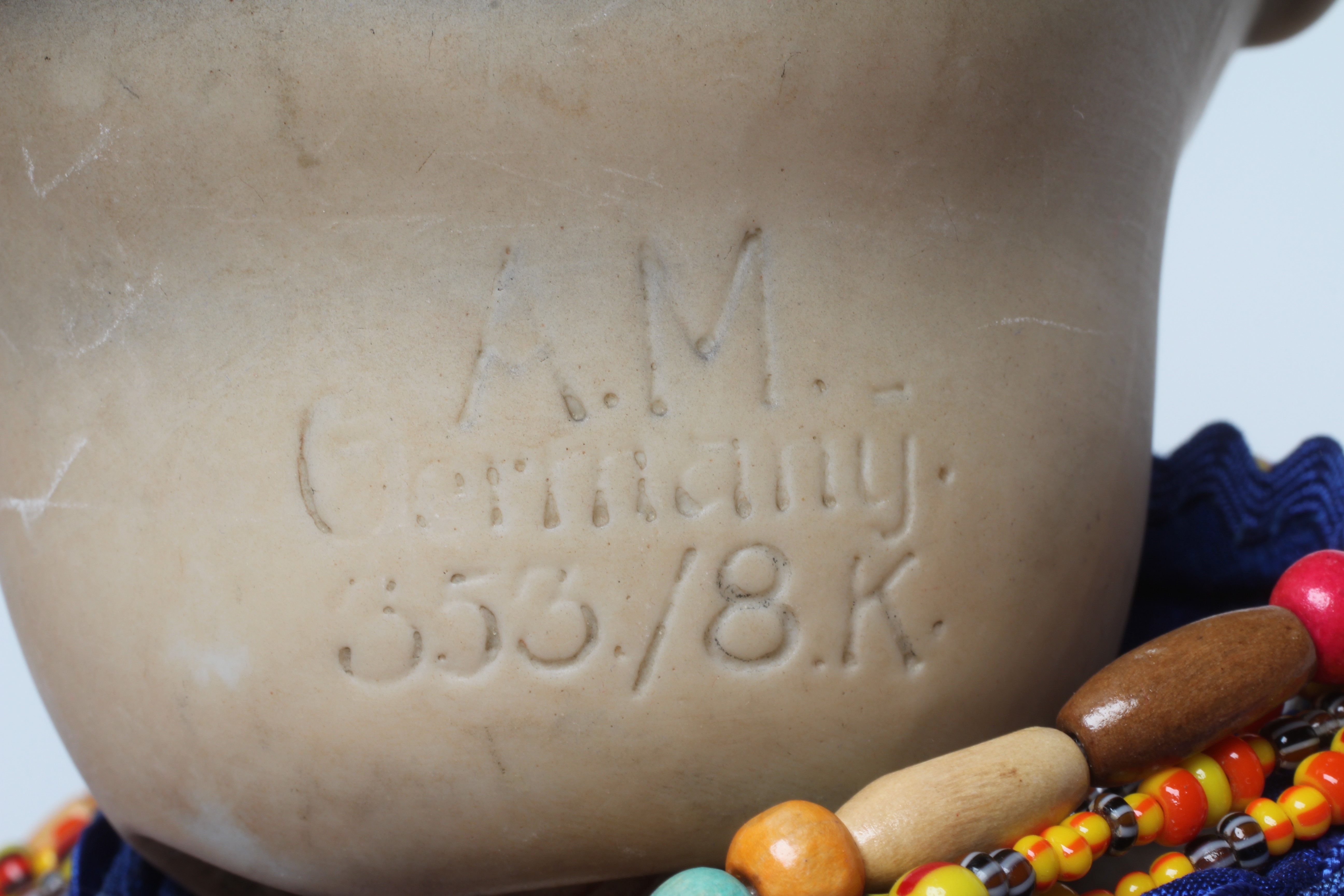 An Armand Marseille bisque socket head Asian doll Image