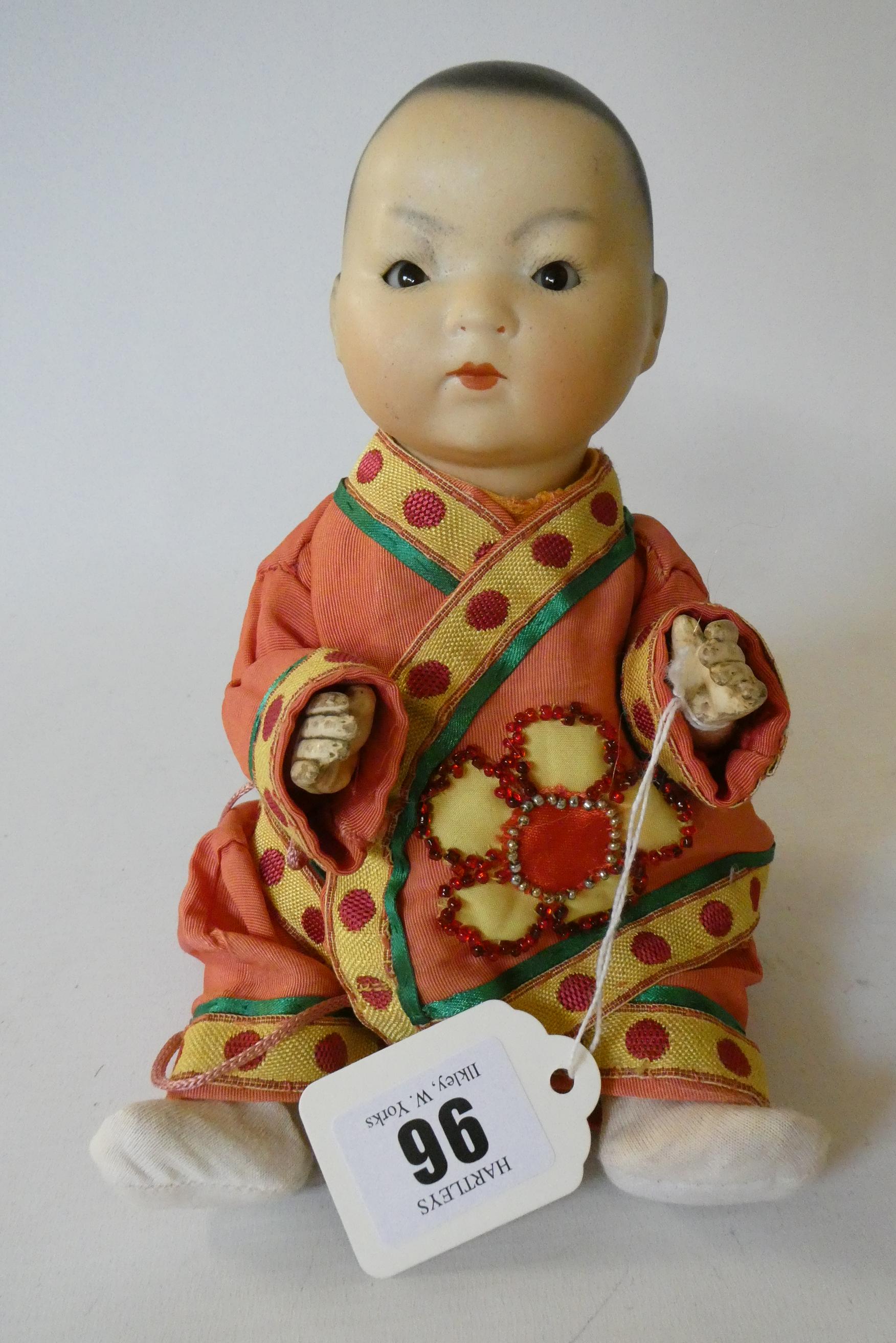 An Armand Marseille bisque socket head Asian doll Image