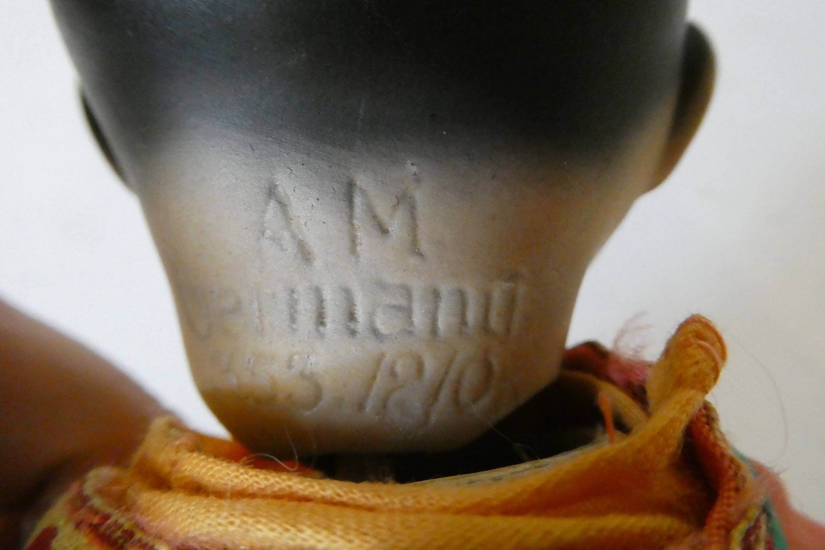 An Armand Marseille bisque socket head Asian doll Image