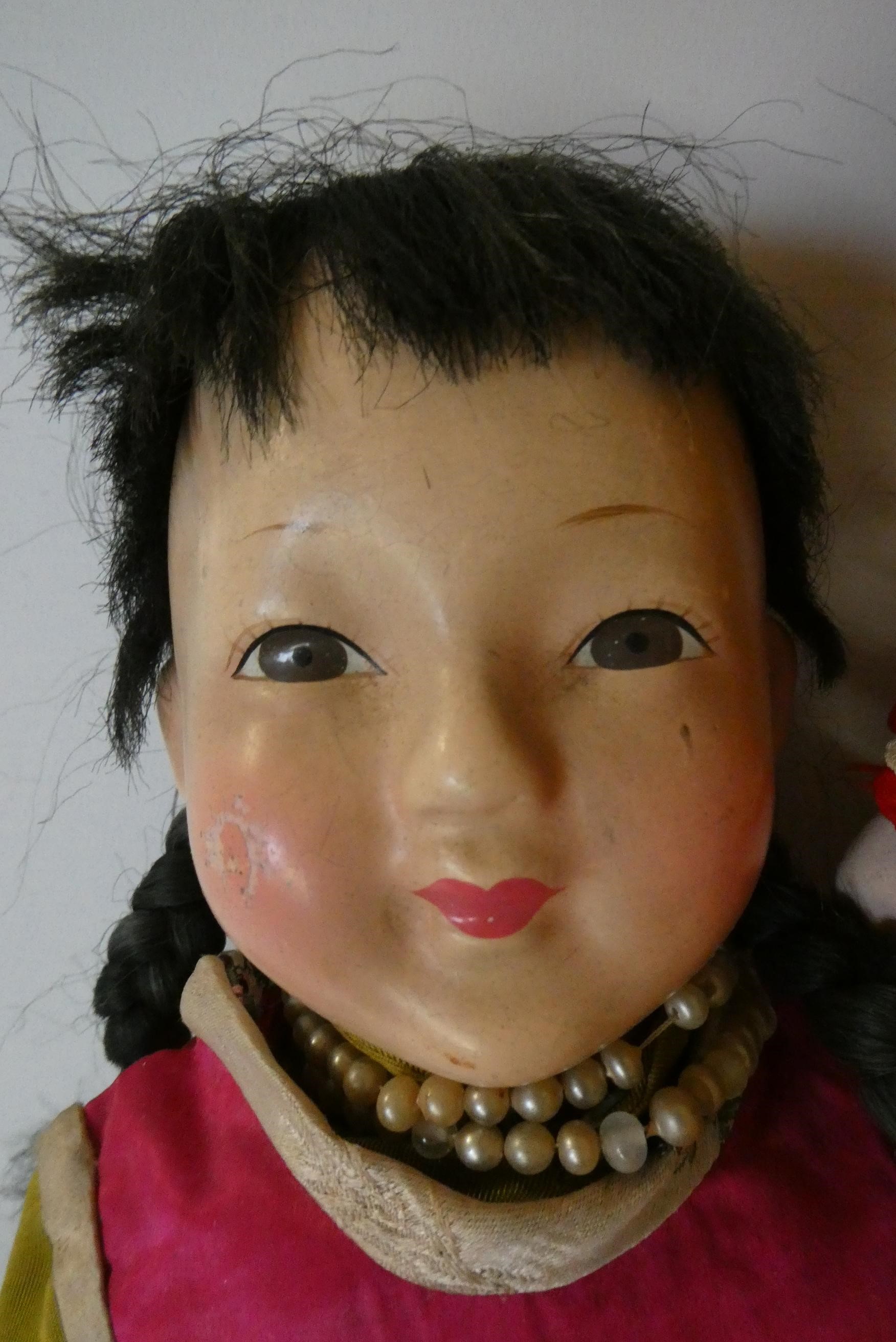 Four composition Asian dolls Image