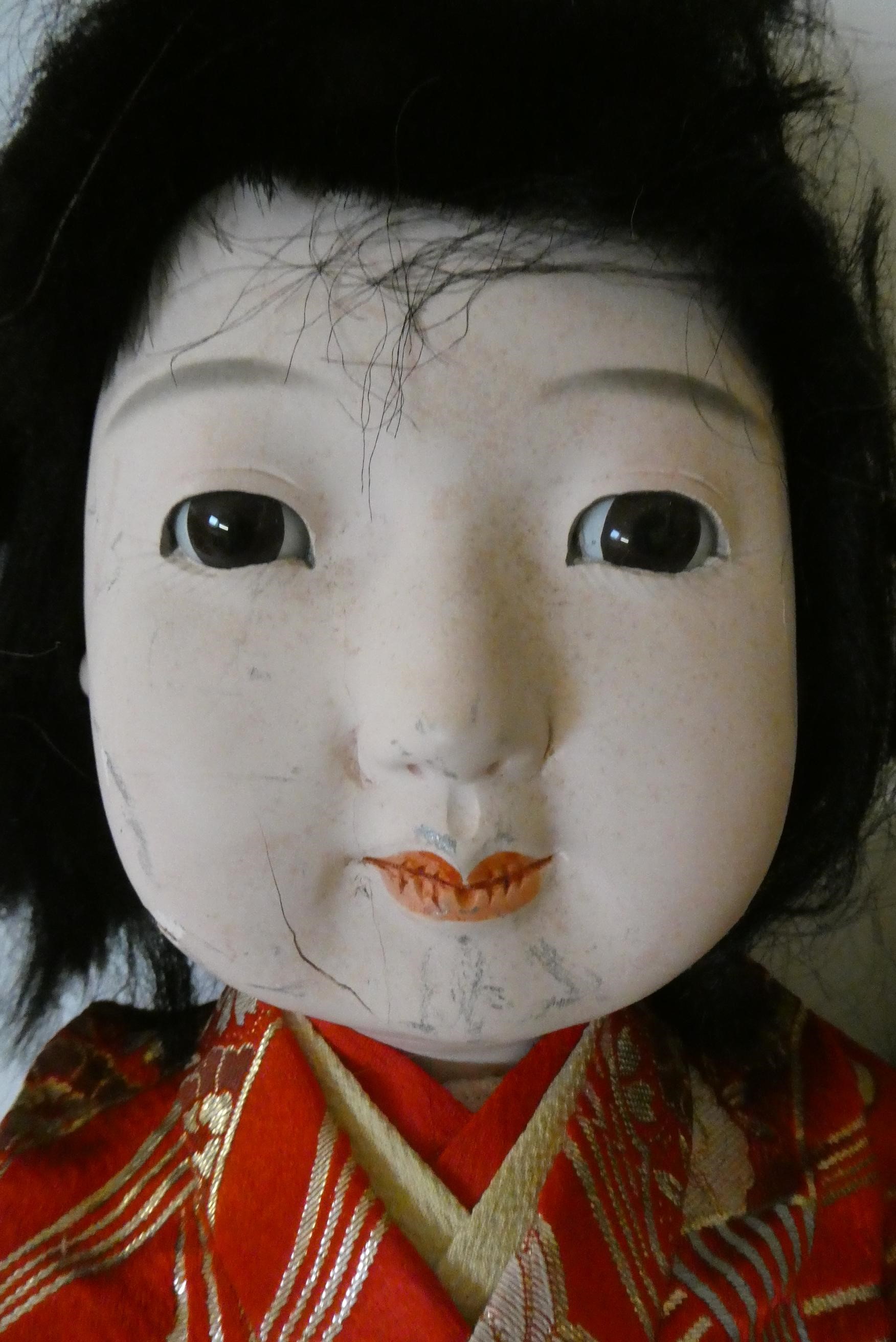 Four composition Asian dolls Image