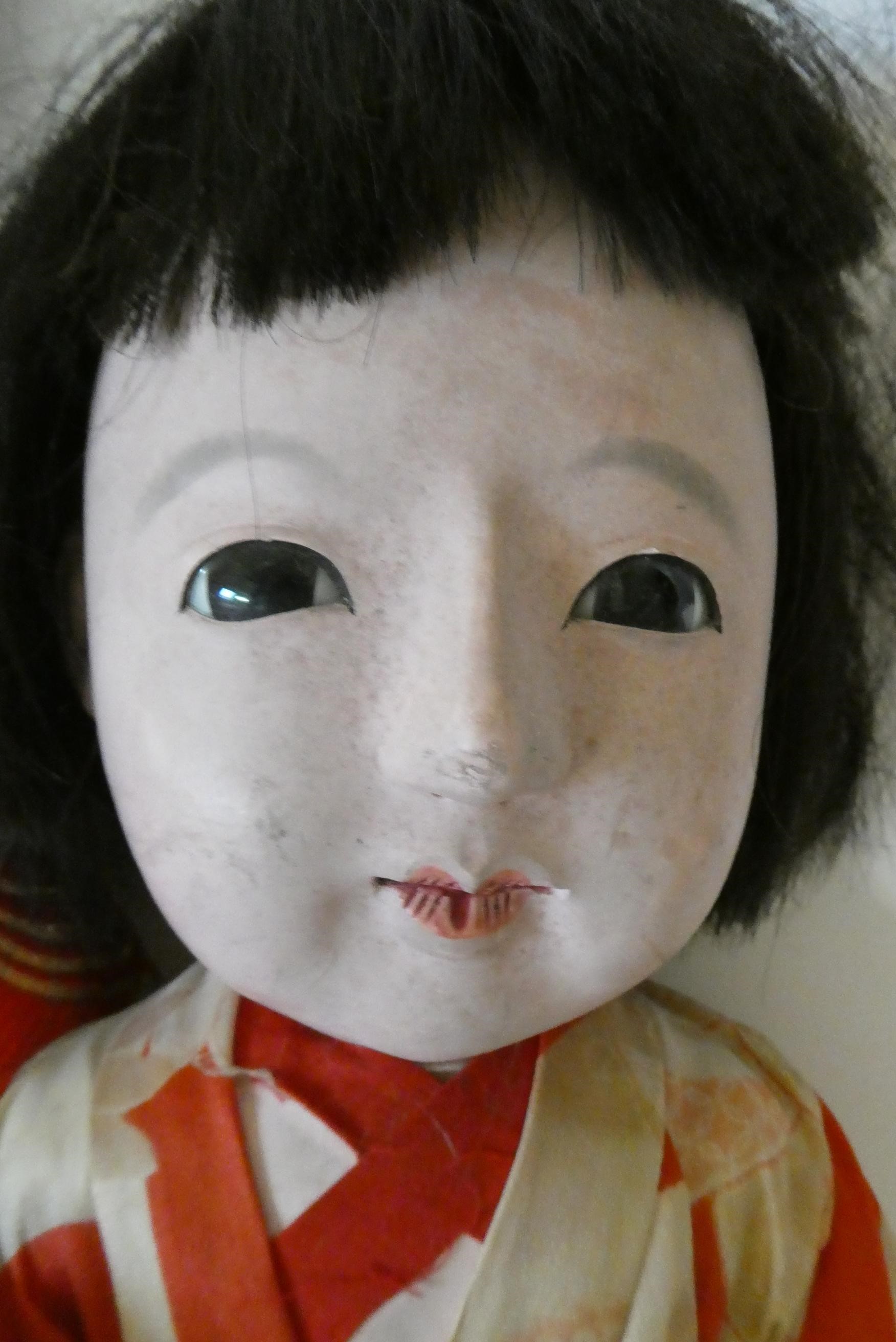 Four composition Asian dolls Image