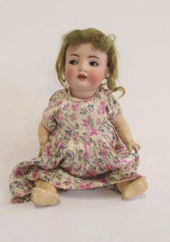 A Franz Schmidt bisque head character doll with blue glass flirty eyes Image