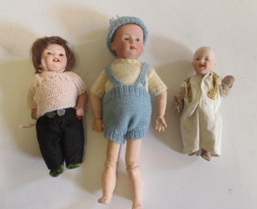 Two Heubach bisque head dolls with intaglio eyes and composition limbs and bodies Image