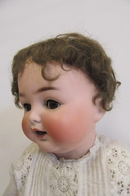 An Ernst Heubach bisque head character doll with cry Image