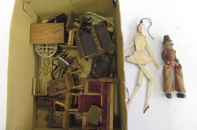 A quantity of early 20th century dolls' house furniture in wood and metal Image