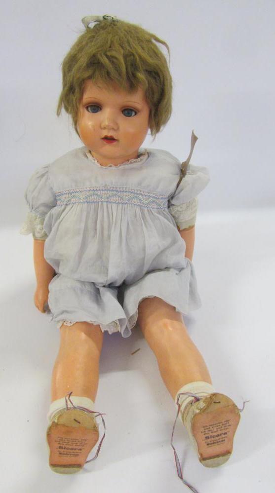 A mid 20th century German composition walking doll with blue glass sleeping eyes Image