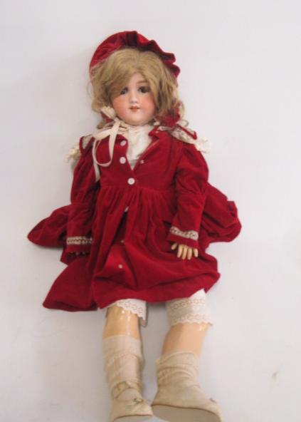 An Armand Marseille bisque head doll with brown glass sleeping eyes Image