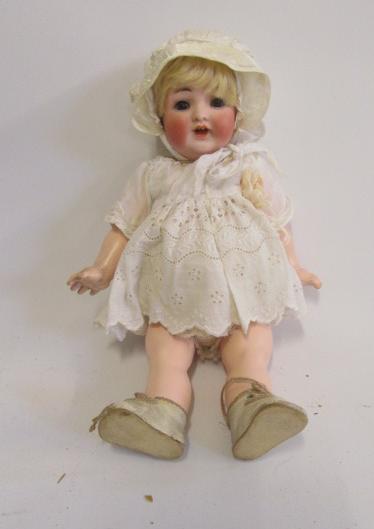 A Kammer & Reinhardt bisque head character doll with brown glass sleeping eyes Image
