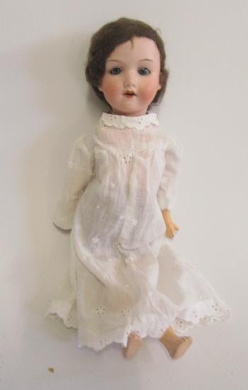 An Armand Marseille bisque head doll with blue glass sleeping eyes Image