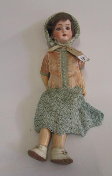 A Schoenau & Hoffmeister bisque head doll with fixed blue glass eyes Image