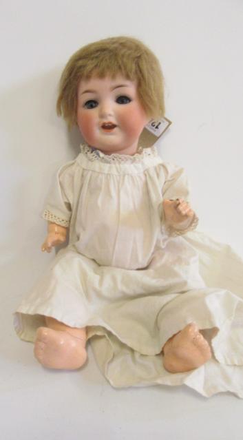 An Ernst Heubach bisque head character doll with blue glass sleeping eyes Image