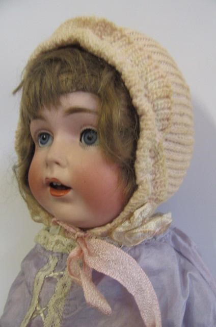 A J.D. Kestner bisque head character doll with blue glass sleeping eyes Image