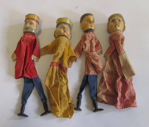 Four puppets with carved painted wood heads Image