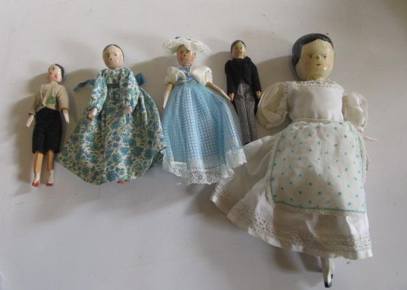 Five wood jointed dolls Image