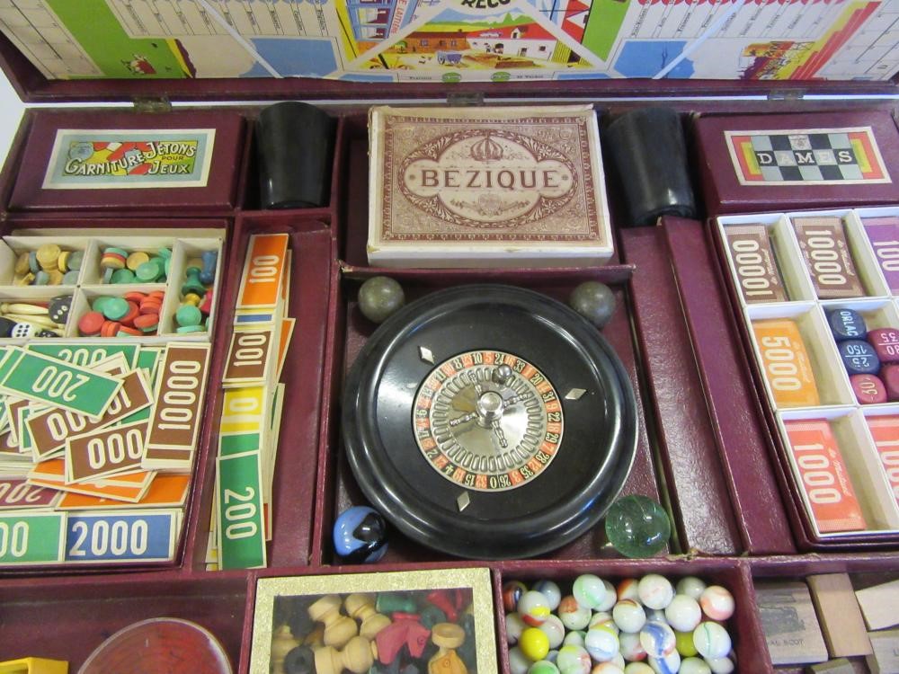 A French mid 20th century games compendium with paper covered wood box containing a large number of Image