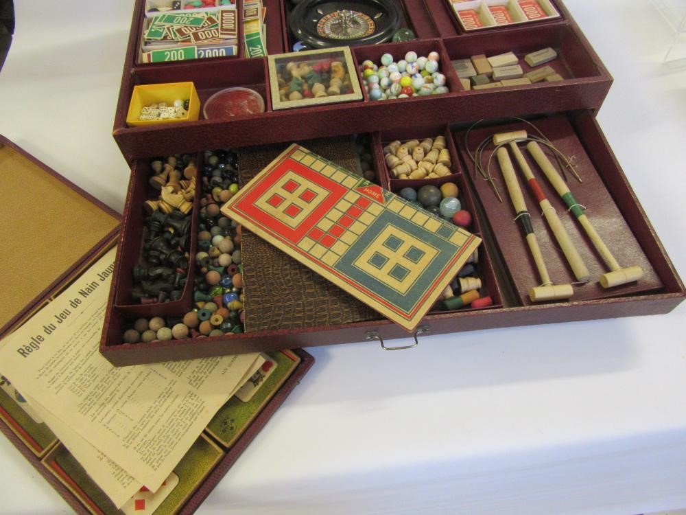 A French mid 20th century games compendium with paper covered wood box containing a large number of Image