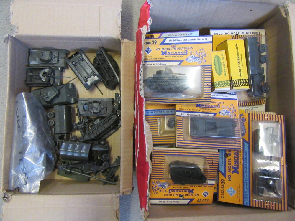 Approximately forty five Roco HO scale plastic military vehicles Image