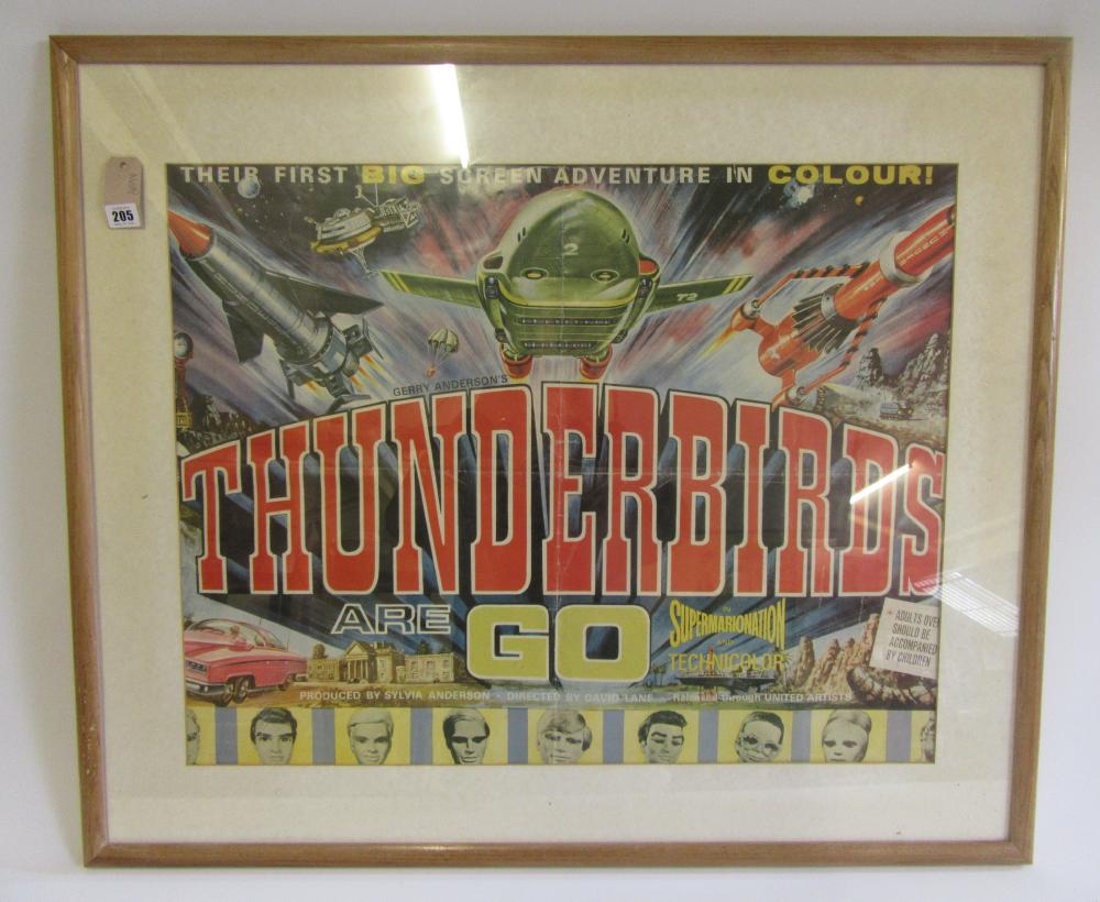 A film poster "Thunderbirds Are Go" in frame with mount Image