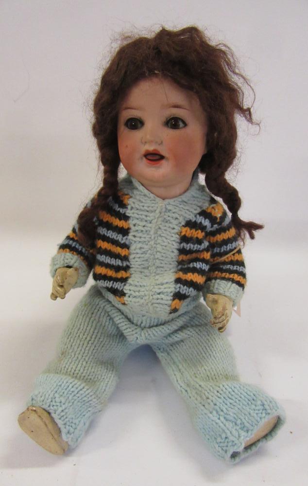 An Ernst Heubach bisque head doll with brown glass sleeping eyes Image