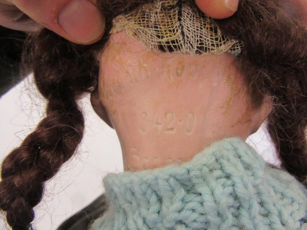 An Ernst Heubach bisque head doll with brown glass sleeping eyes Image