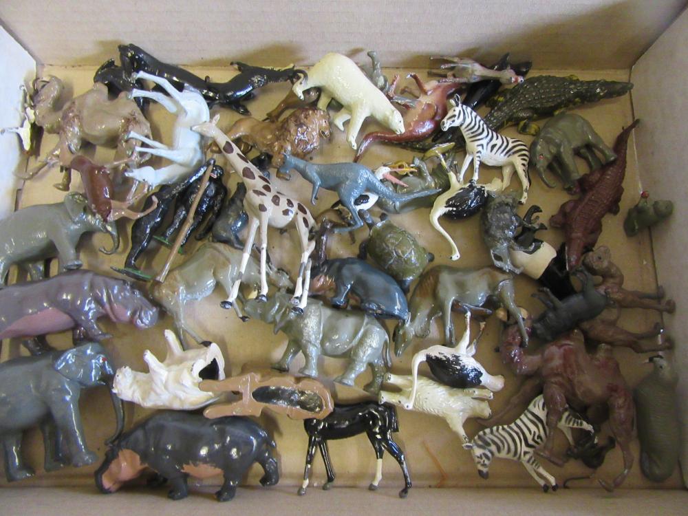 Approximately fifty Britains and other lead zoo animals Image