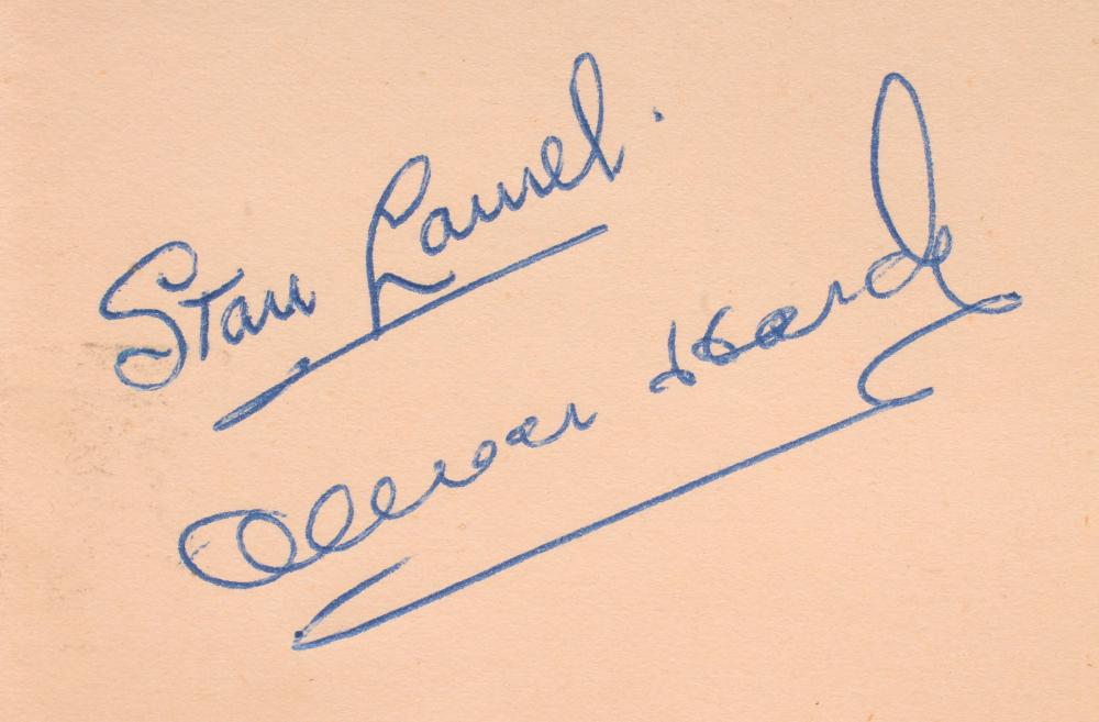 Stan Laurel and Oliver Hardy autographs in album also containing:- Wilfred Pickles Image