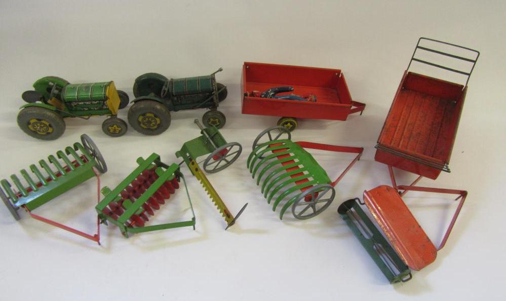 Nine Mettoy and other tinplate farm items comprising two tractors Image