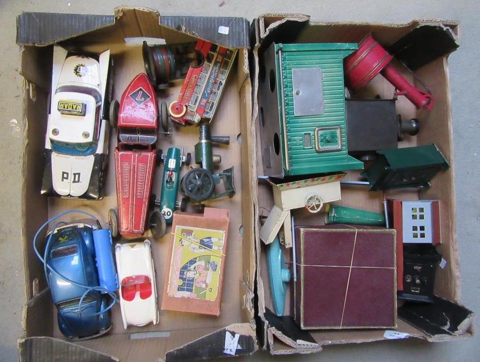 A collection of eighteen tinplate toys including six various vehicles Image