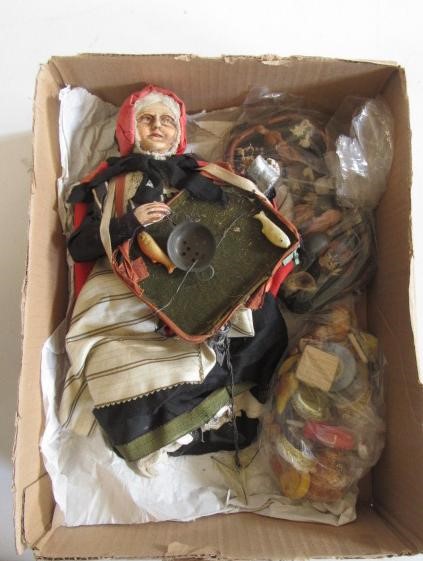 A composition lady peddler doll Image