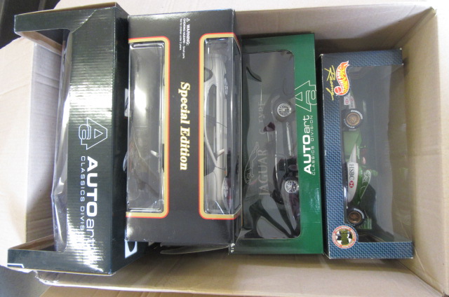 Fourteen Maisto and other larger scale diecast car models Image