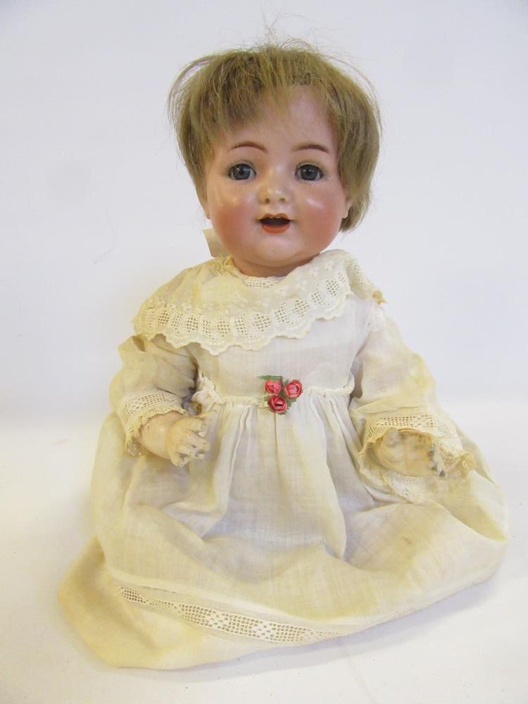 A Kammer & Reinhardt bisque head character doll with blue glass sleeping eyes Image