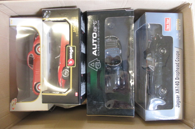 Twelve Burago and other larger scale diecast car models Image