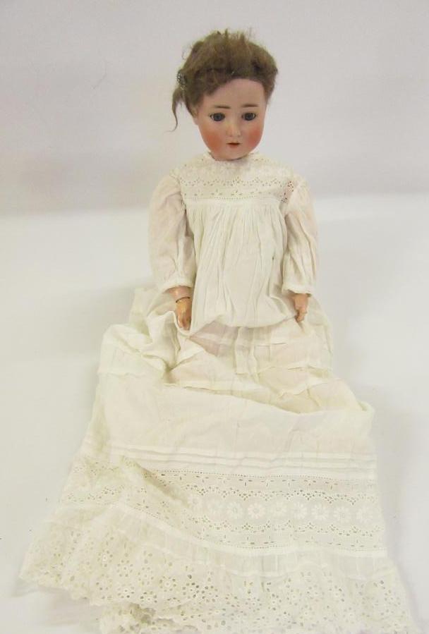 An A Schoenau & Hoffmeister bisque head doll Image