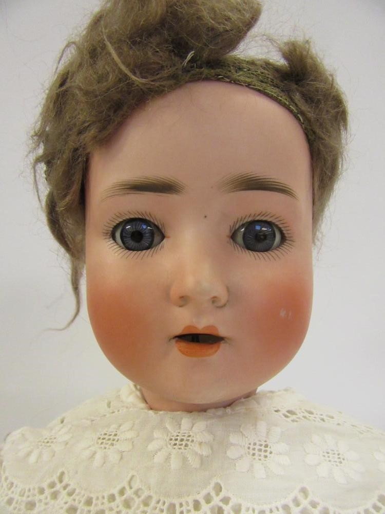 An A Schoenau & Hoffmeister bisque head doll Image