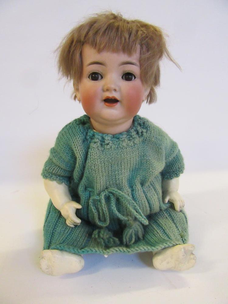 A Kammer & Reinhardt bisque head character doll with brown glass flirty eyes Image