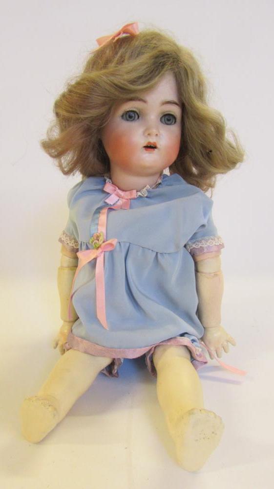 A Kammer & Reinhardt bisque head doll with blue glass sleeping eyes Image