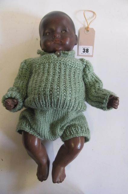 An Armand Marseille bisque head brown "Dream Baby" doll with painted Image