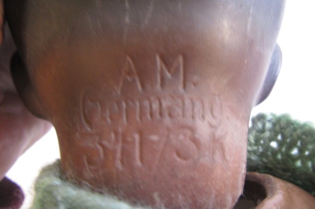 An Armand Marseille bisque head brown "Dream Baby" doll with painted Image