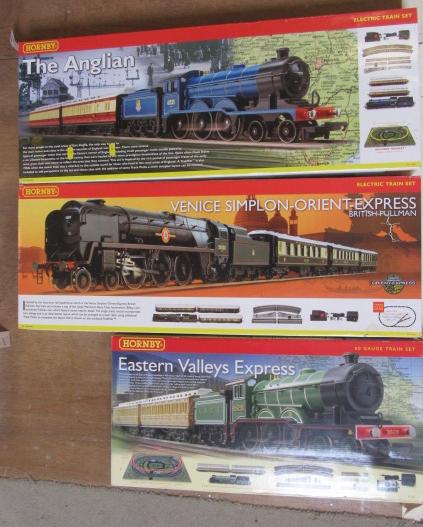 Three hornby train sets comprising the anglican Hartleys Auctioneers Valuers