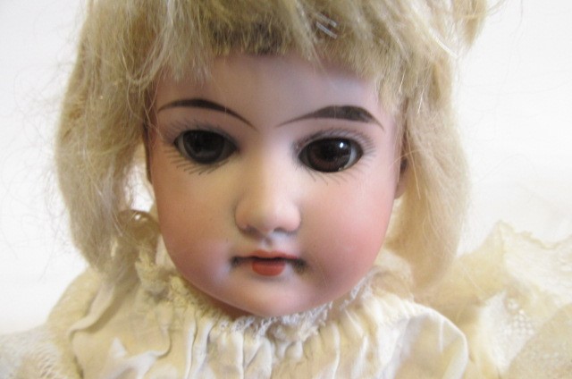 An Armand Marseille bisque head and shoulders doll Image